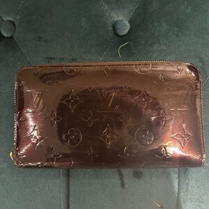 Louis Vuitton large patent leather zip wallet.